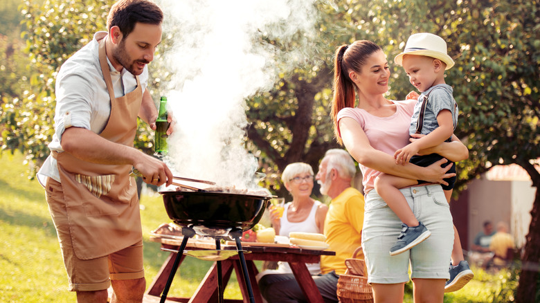 Family using public grill