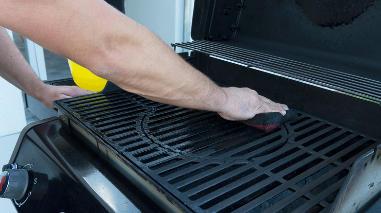 Hand cleaning a gas grill