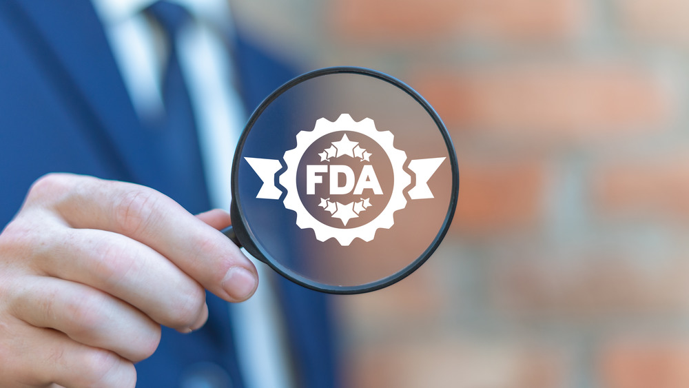 FDA sign on magnifying class