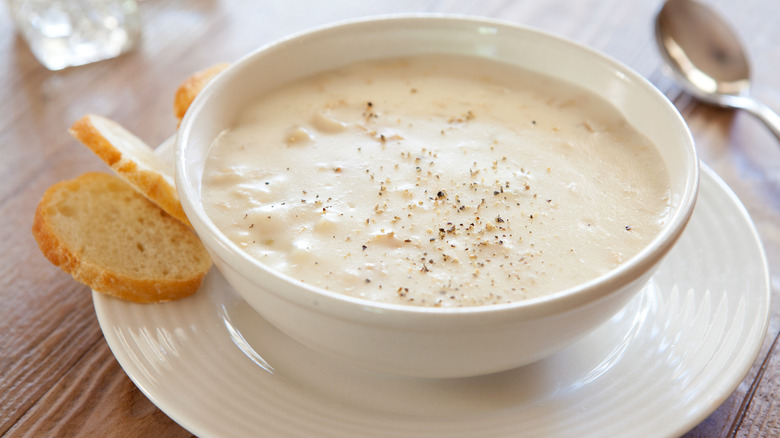 Clam chowder in white bowl