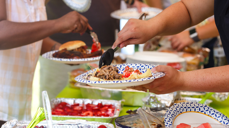 Multiple dishes of food on dark wooden table