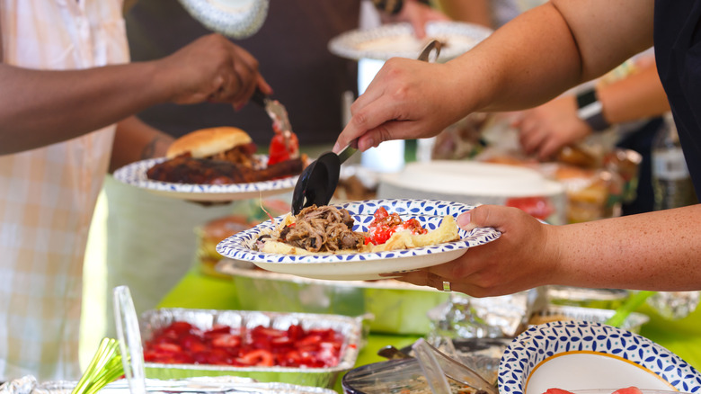 Multiple dishes of food on dark wooden table