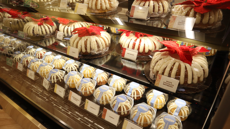 Cakes and cupcakes on display inside a Nothing Bundt Cakes shop