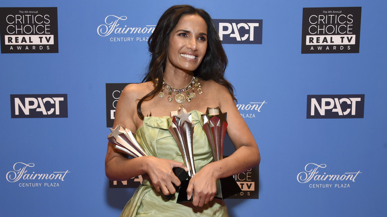 Padma Lakshmi holding trophies