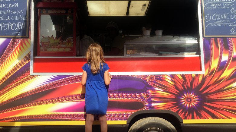 Girl ordering from food truck