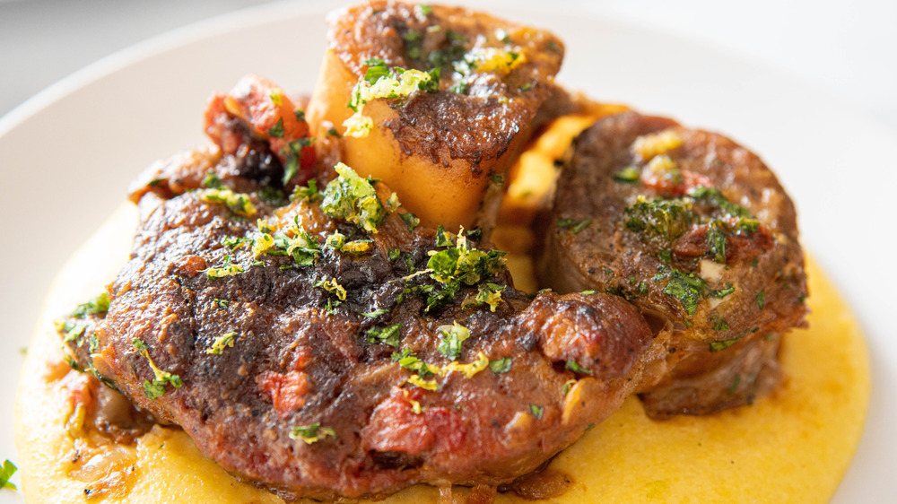 ossobucco on white plate with polenta