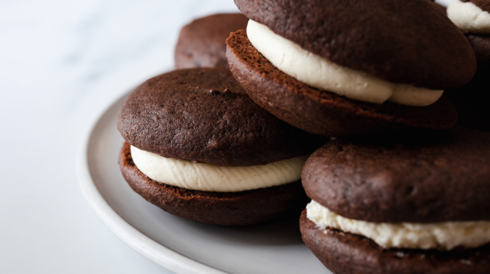 Close up of a whoopie pie chocolate cookie with white frosting filling