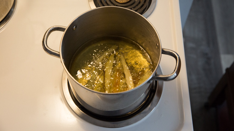 fries frying in medium pot