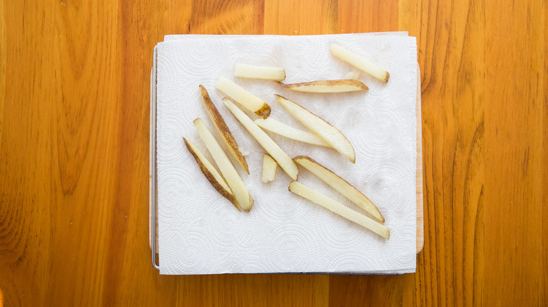 fries draining on paper towels