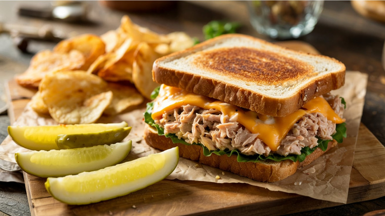 Tuna melt with pickles and chips on the side