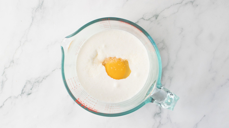 Buttermilk and egg in measuring cup