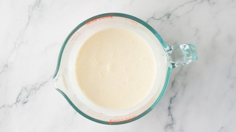 Buttermilk marinade in measuring cup