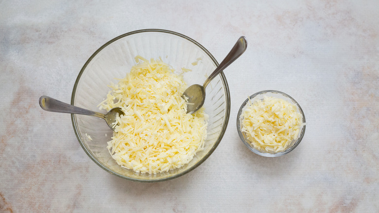 shredded cheese in two bowls