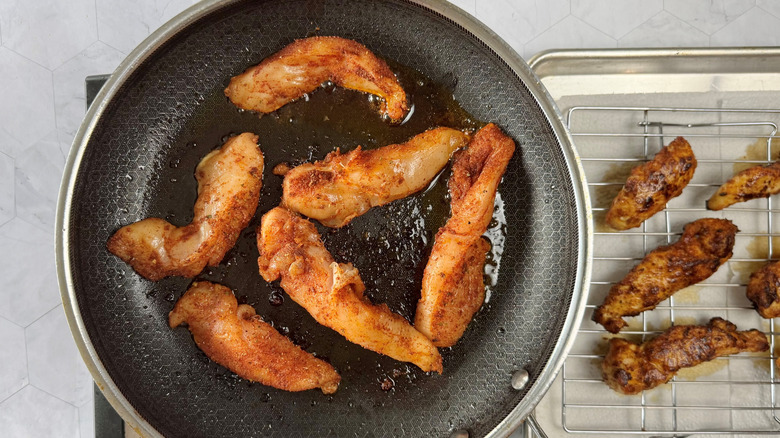 chicken strips in a frying pan