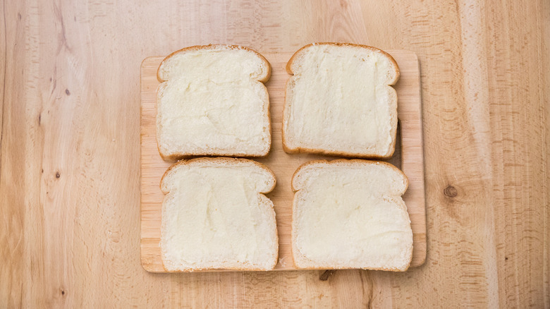 buttered bread on cutting board