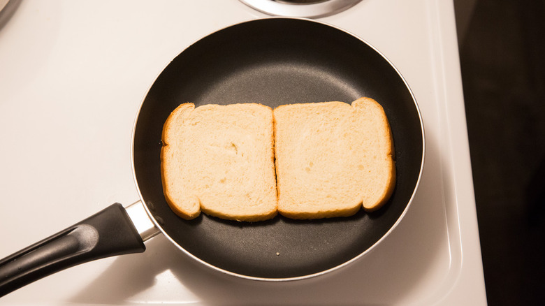 bread toasting in nonstick pan