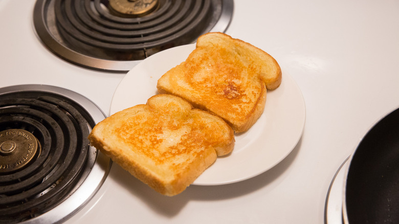 cheese toast on white plate