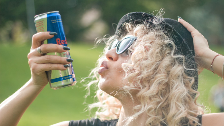 Woman blowing kiss at Red Bull