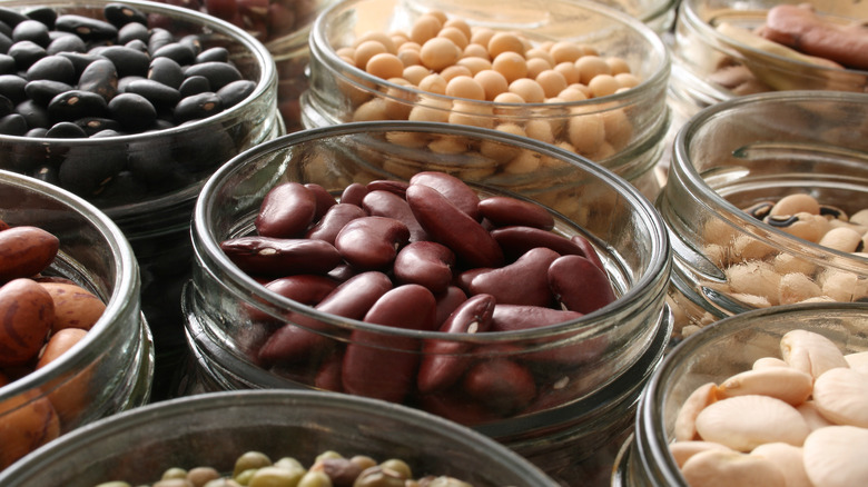 A variety of dried beans in jars 