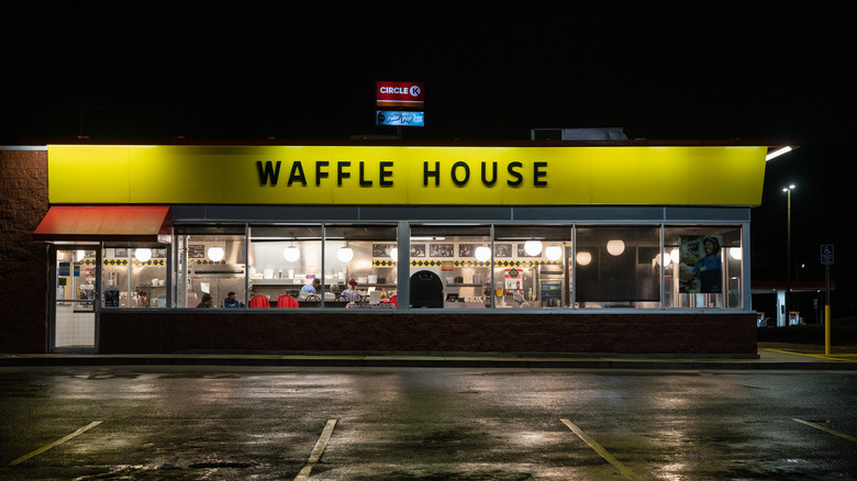 The exterior of a Waffle House at night