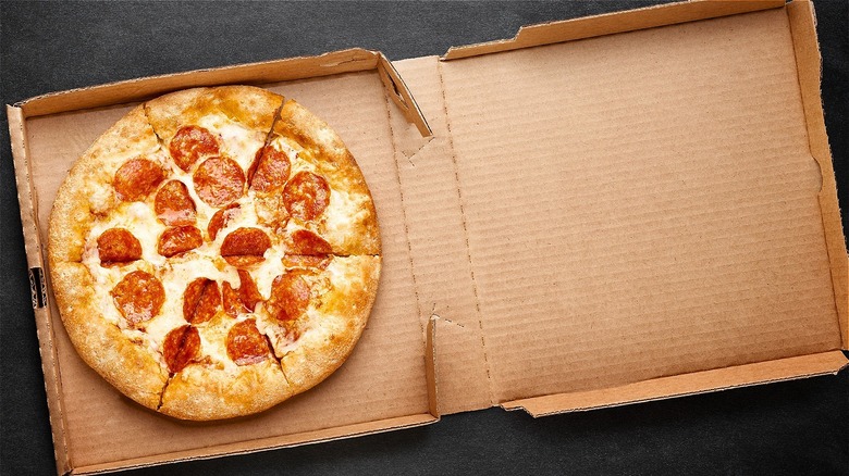 Pepperoni pizza in an open cardboard box