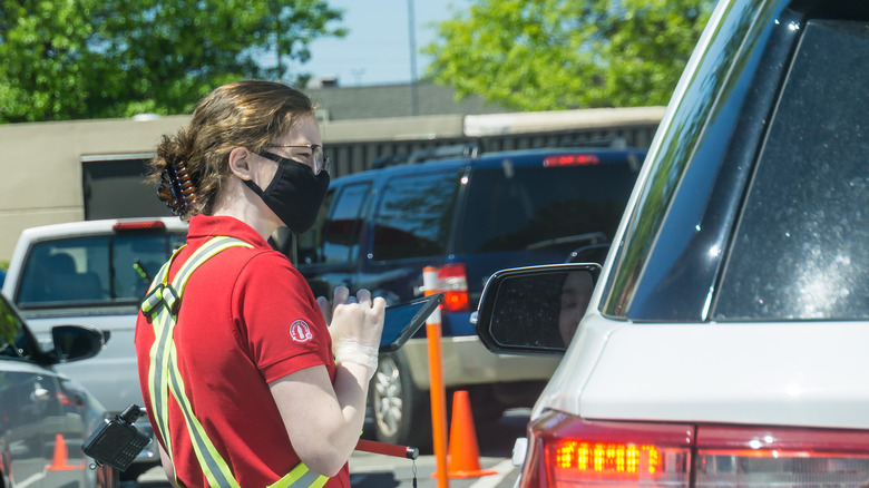 Chick-fil-A employee with tablet