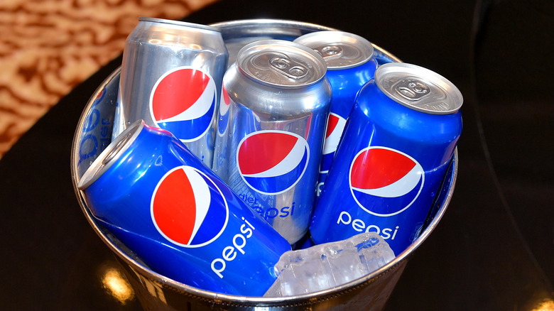 Cans of Pepsi in a bucket of ice