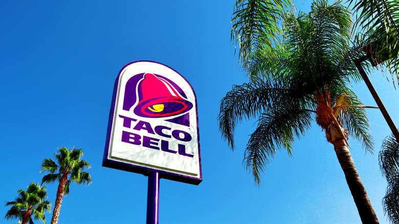 Taco Bell sign in the palm trees
