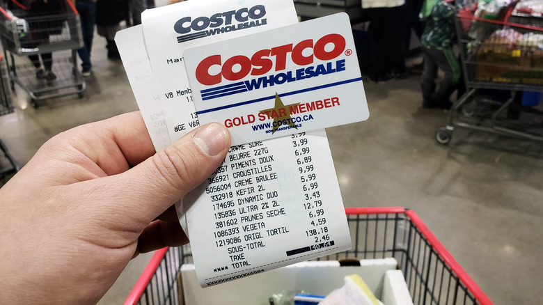 costco wholesale card and receipt in front of shopping cart