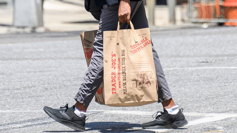 Trader Joe's customer holding grocery bag