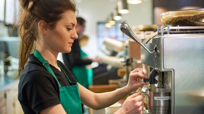 Starbucks barista making drink