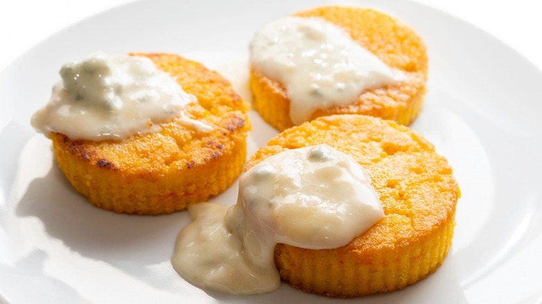 Polenta slices with creamy sauce