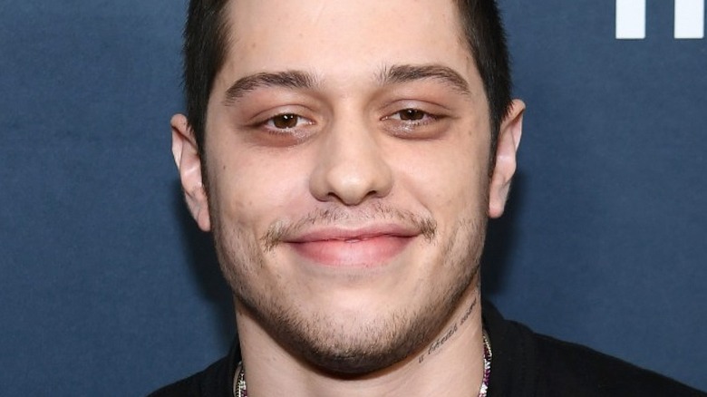 Pete Davidson smiling on the red carpet