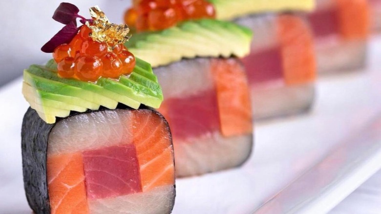 ornately topped sashimi Roll