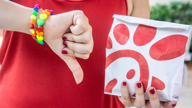 Thumbs down next to chick-fil-a bag