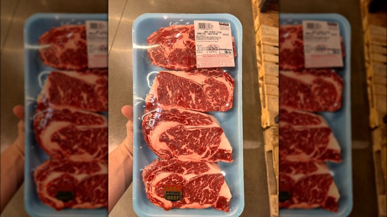 Steaks in a blue tray