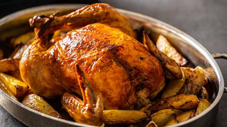 crispy chicken over potatoes