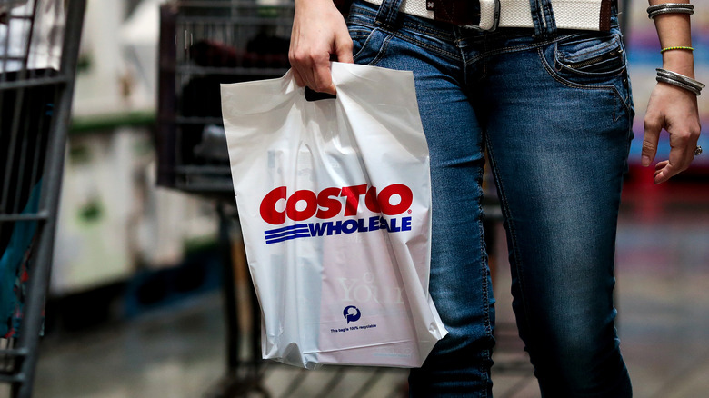 Someone holding a Costco Wholesale bag