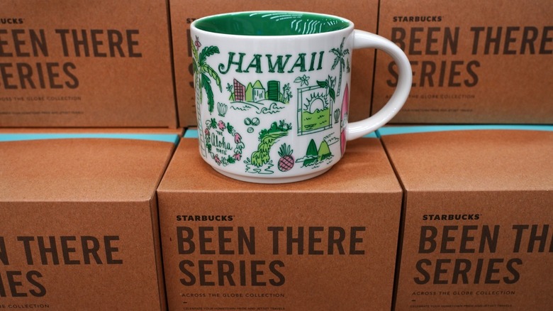 A Starbucks Hawaii coffee mug on boxes