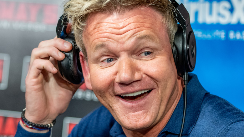 chef gordon ramsay smiling with headphones