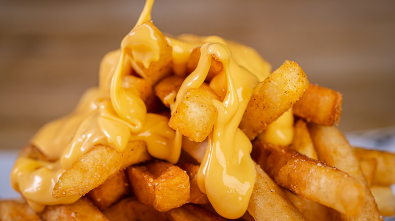 closeup of fries with nacho cheese