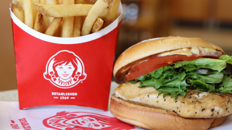 A close-up of Wendy's french fries and a chicken sandwich