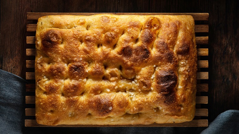 focaccia bread on wooden rack