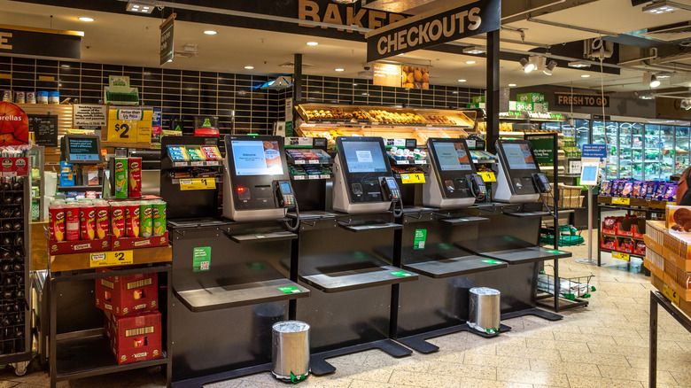 A row of self-checkout machines