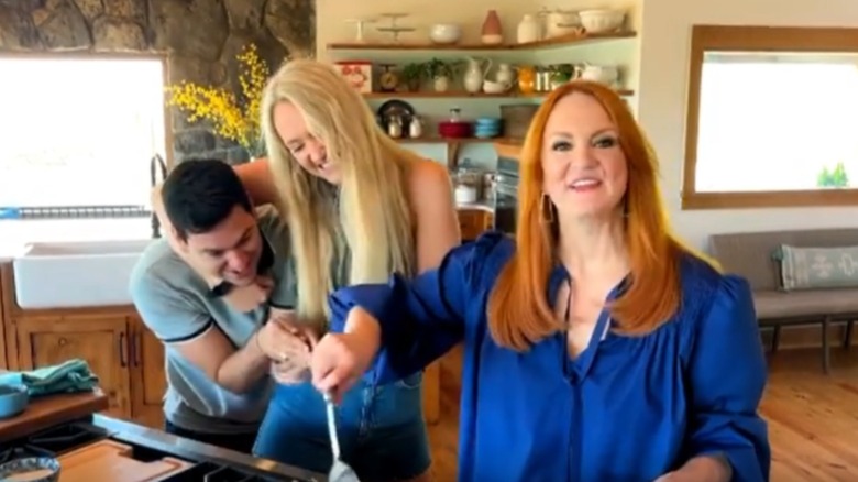  Ree Drummond with family joking in kitchen