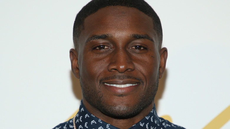 Reggie Bush wearing printed shirt and chain