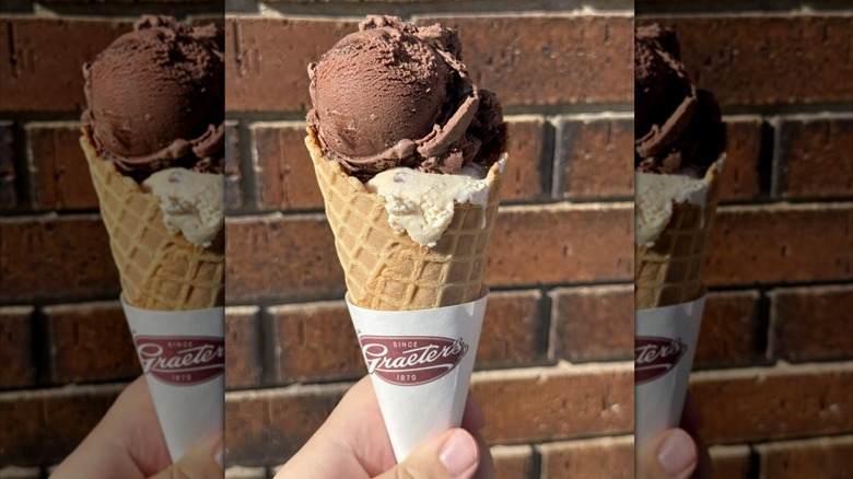 Ice cream cone from Graeter's in front of brick wall