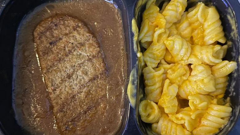 Boston Market salisbury steak and macaroni and cheese reheated in original container
