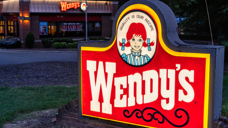 Wendy's sign with restaurant in the background