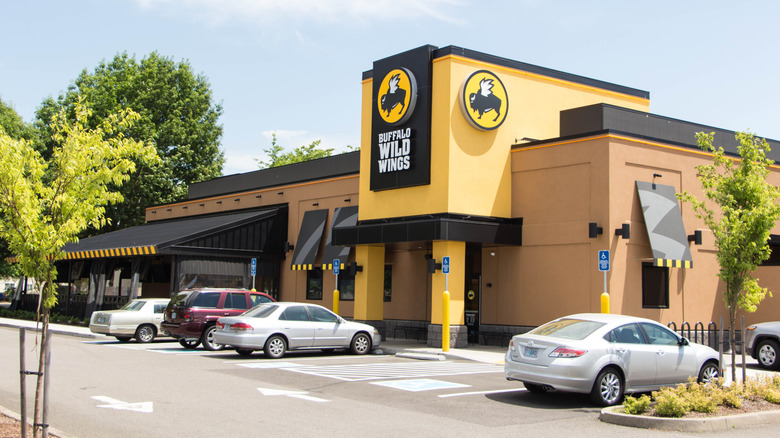 Cars park outside a Buffalo Wild Wings.